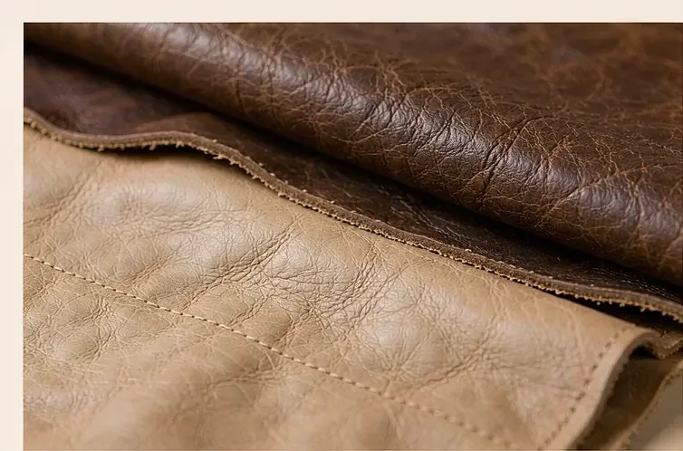 folded vegetable-tanned leather showing its grain, thickness and natural edge